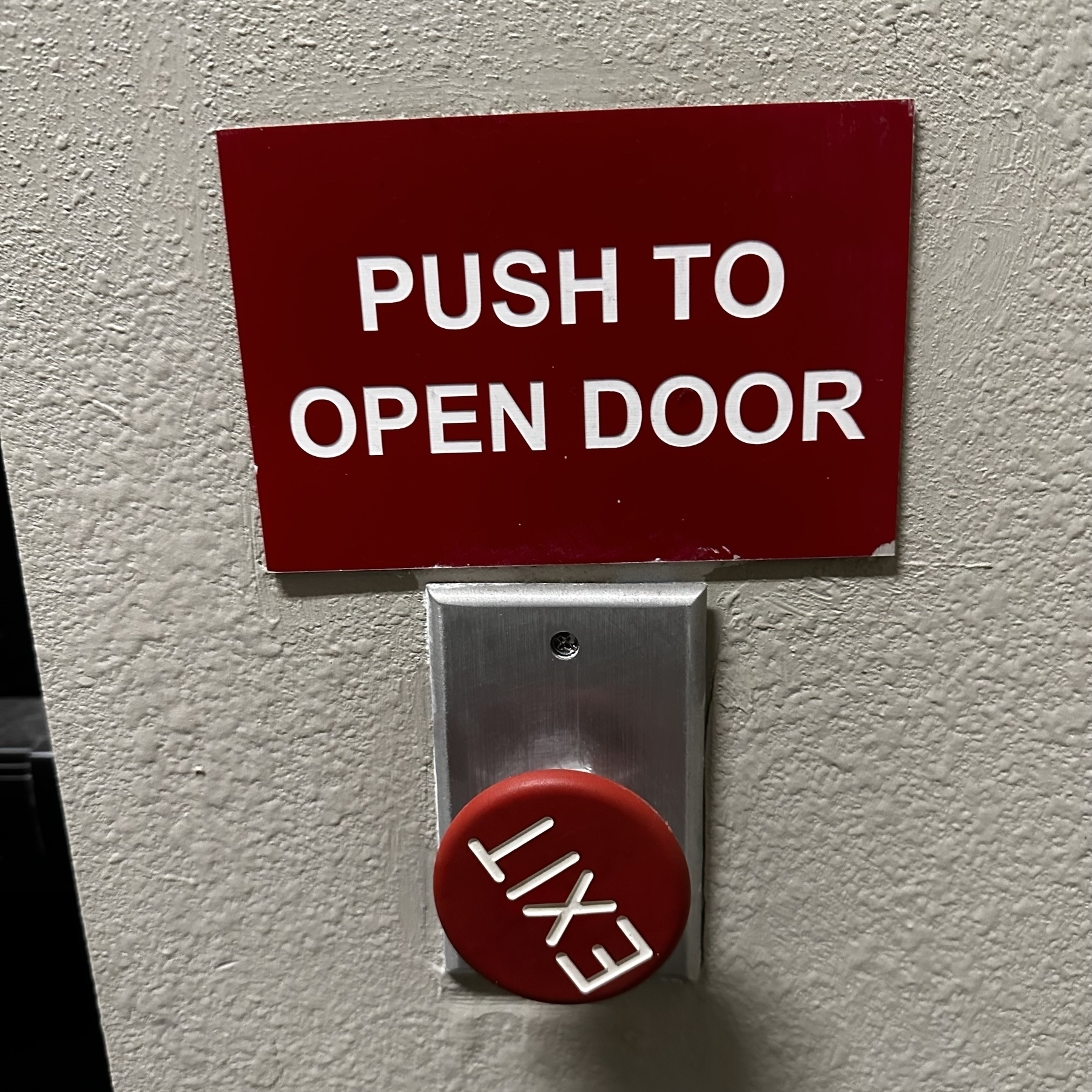 Red to open door with a big red exit button, which is twisted so the word exit is vertical