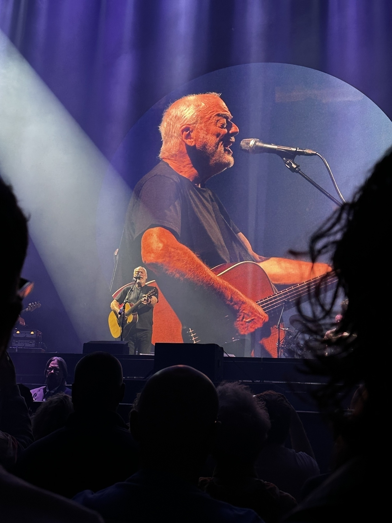 David Gilmour with an acoustic guitar on stage at Madison Square Garden.